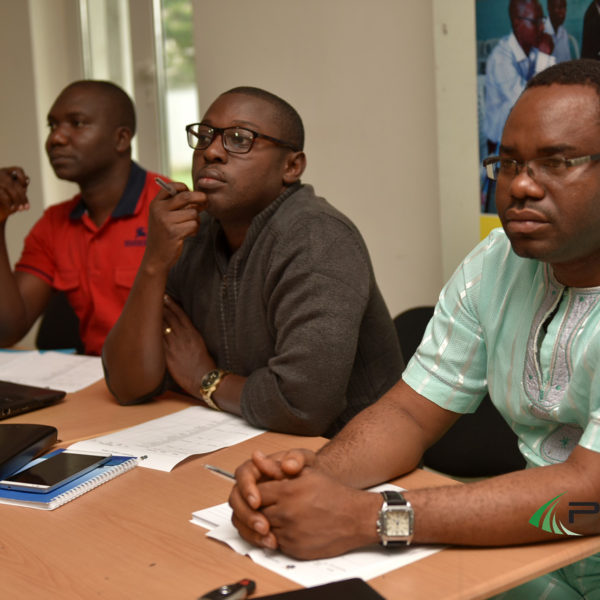 L-R Mr Isreal (Dr FIsh), Precious Abunno and Misan Edema Silo, judges of the exercise listening to presentations by participant's presentation
